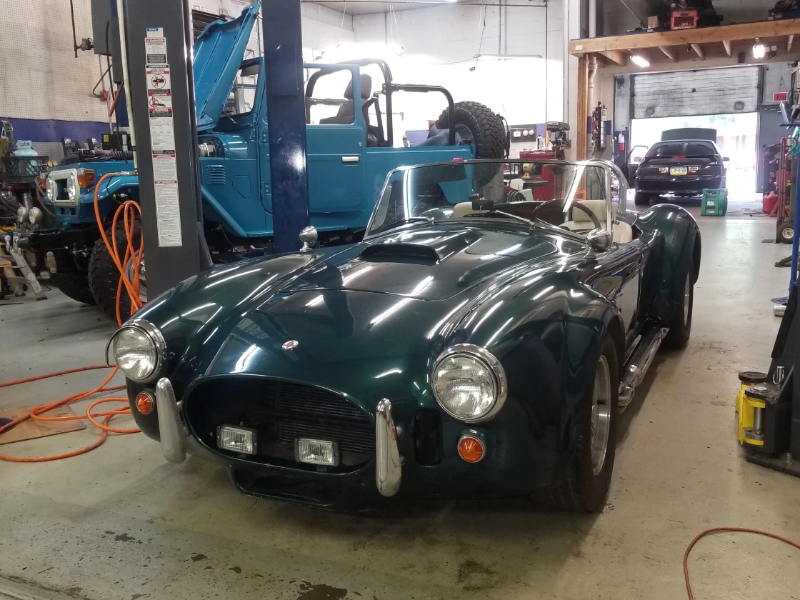 Classic Green Sports Car in the shop 1
