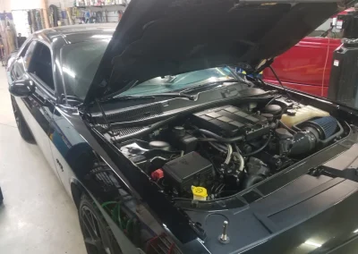 black dodge challenger in the shop