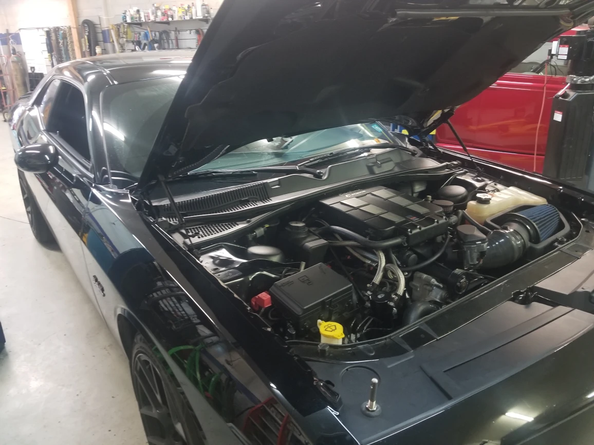 black dodge challenger in the shop